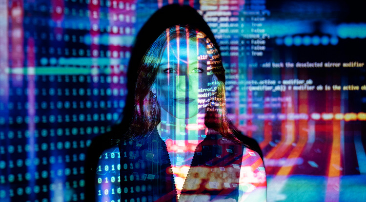 a woman facing directly at the camera while a colorful overlay of computer code is projected overtop her and the backdrop