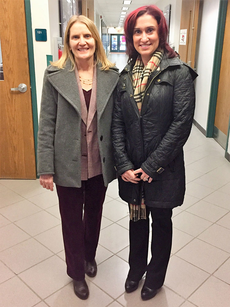 Pamela Spikner, right, meeting with Kim Anderson