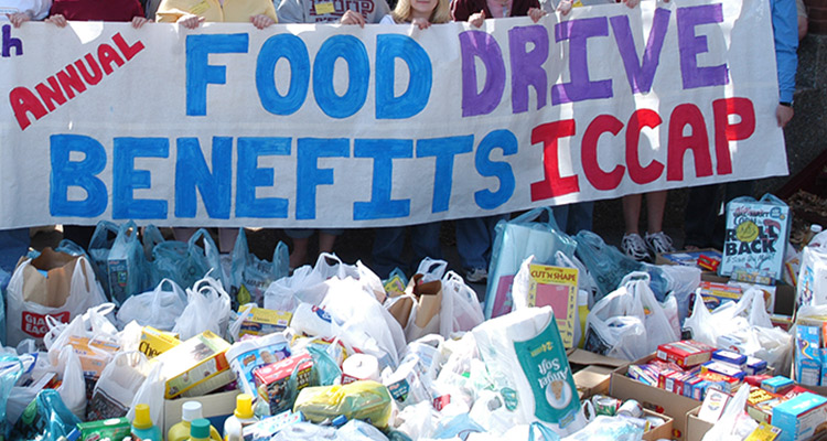 Food Drive sign with food on the ground 