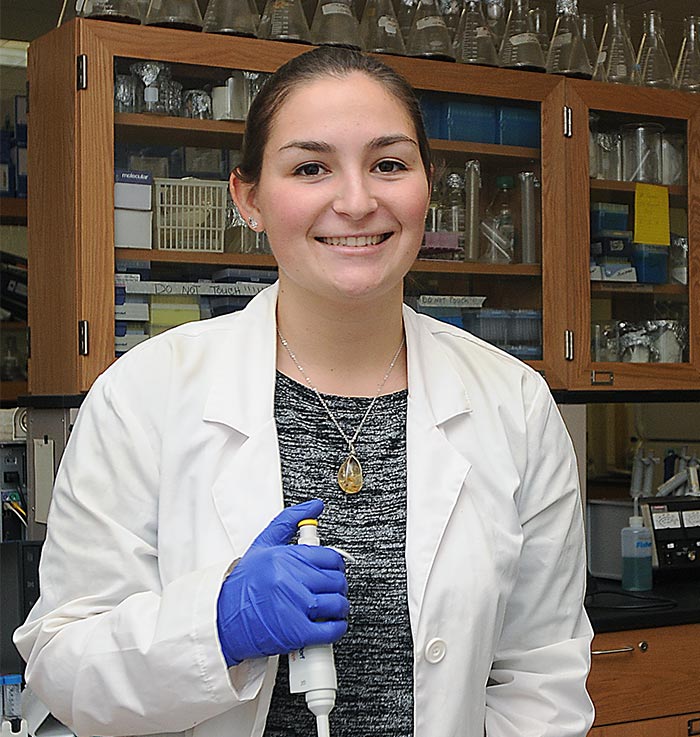 Anna Manges in a lab