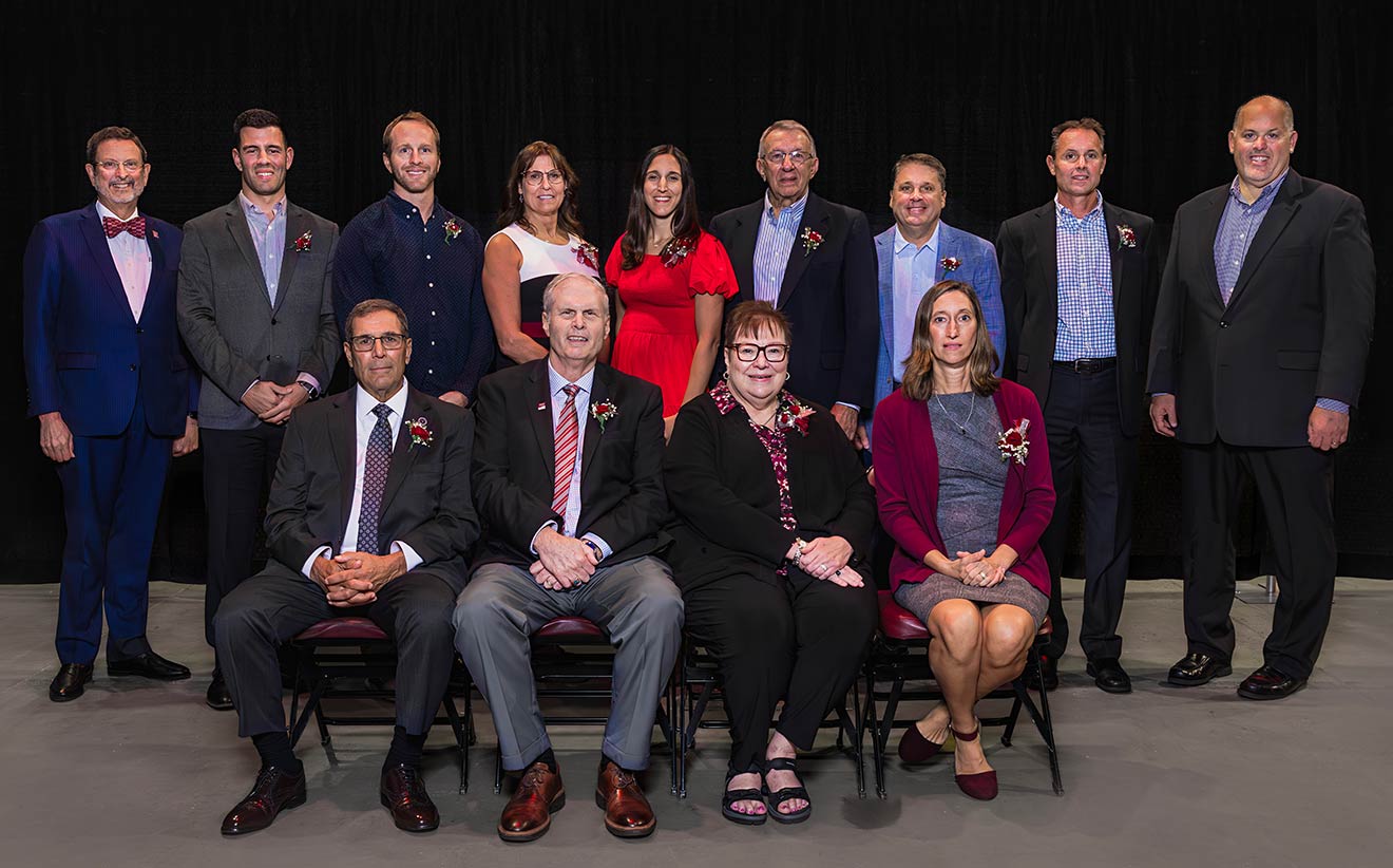 The IUP Athletics Hall of Fame Class of 2025, with IUP President Michael Driscoll and IUP Athletics Director Todd Garzarelli