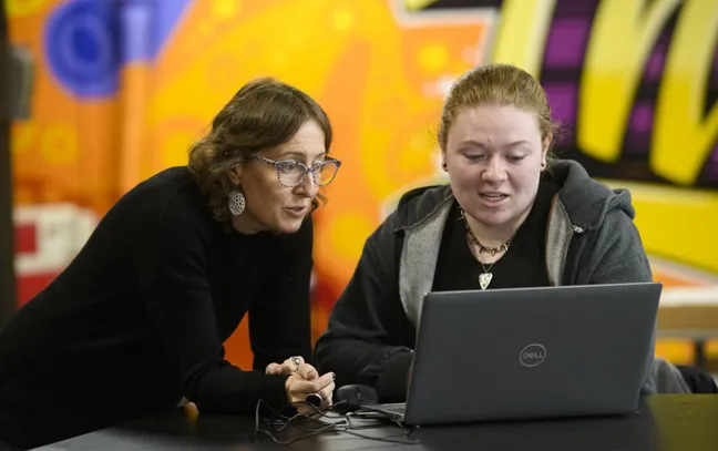artistic image of a woman waking through a lab