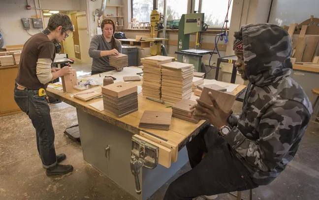 artistic image of a woman waking through a lab