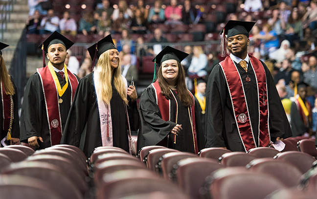 Four students at commencement