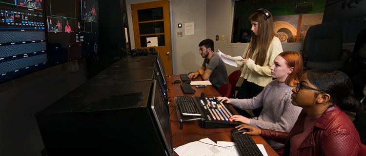 Comm media students in a production booth 