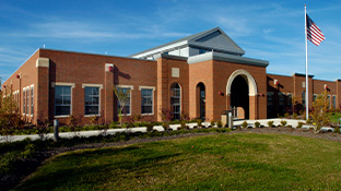 Northpointe building with an American flag flying in front of it.