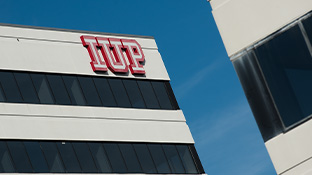 Top-right corner of the Pittsburgh East building with the IUP logo.