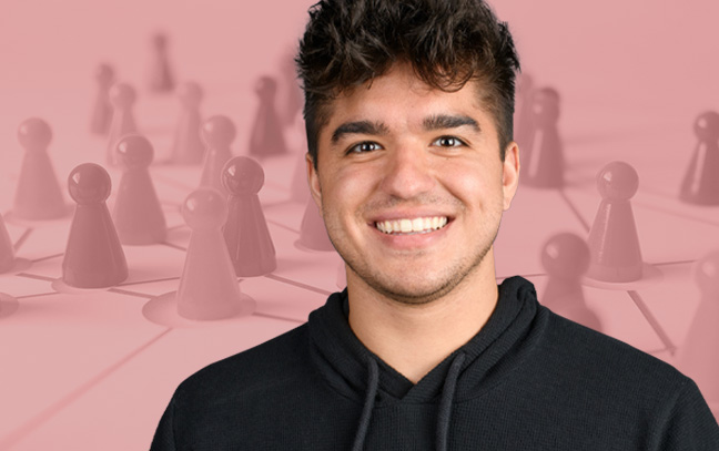 A student being superimposed in front of a peach-colored background with pawns on a board.