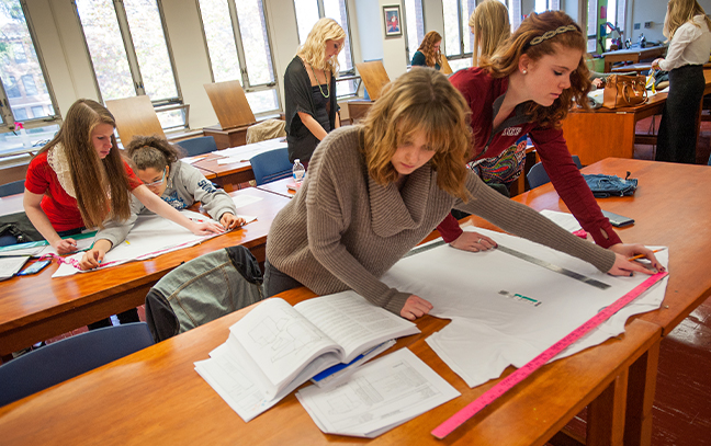 Students working on a fashion project