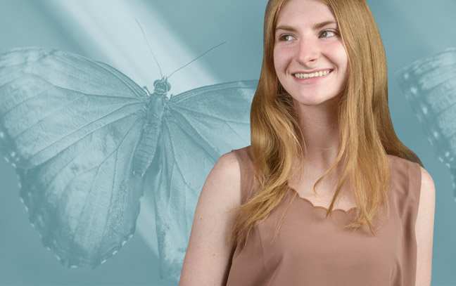 A student being superimposed in front of a cyan background with a butterfly.