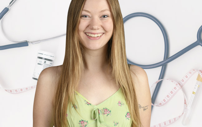 A student being superimposed in front of a white background with medical equipment.