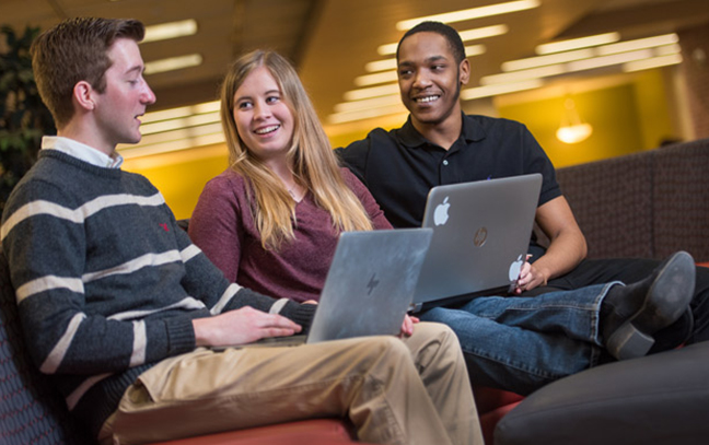students sitting in a classroom talking