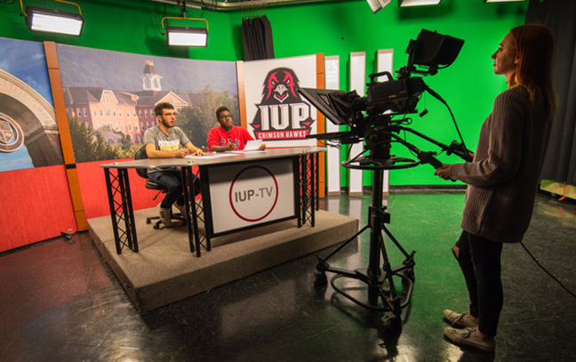 students working in a film recording studio