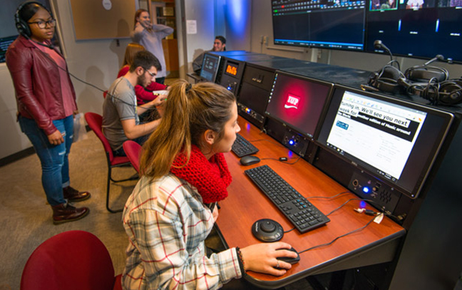 students working on controls in a studio