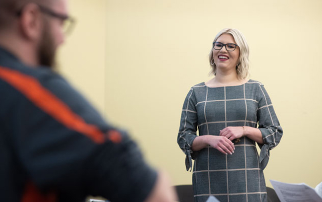 far shot of a professor teaching in a classroom