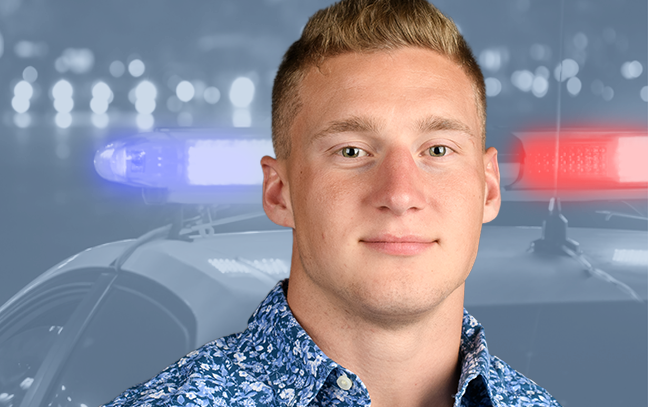 A student being superimposed in front of a background showing the roof of a police car.