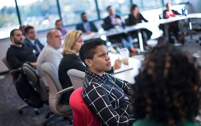 Students sitting as a teacher lectures