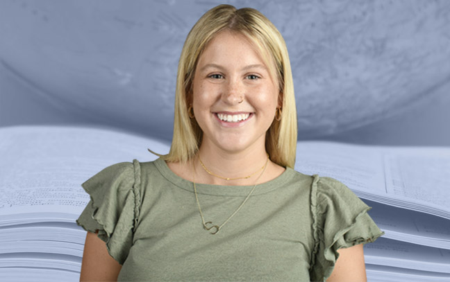 A student being superimposed in front of a blue background with a book.