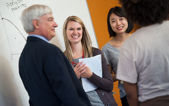 Students sitting as a teacher lectures