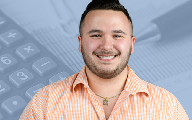A student being superimposed in front of a blue background with a keyboard and other office supplies.