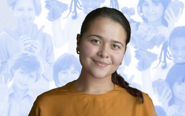 a female student superimposed on a blue backdrop containing a children holding fruits and vegetables