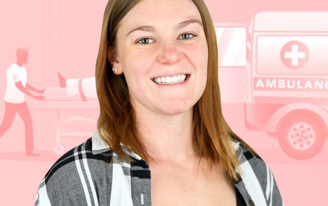 a student smiling in front of a pink clipart backdrop