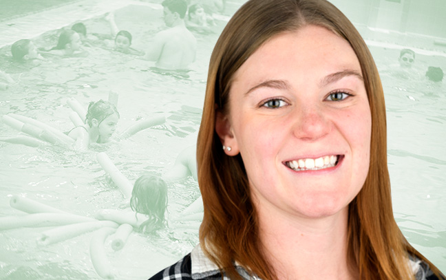 A student being superimposed in front of a sage-green background showing kids playing in a pool.