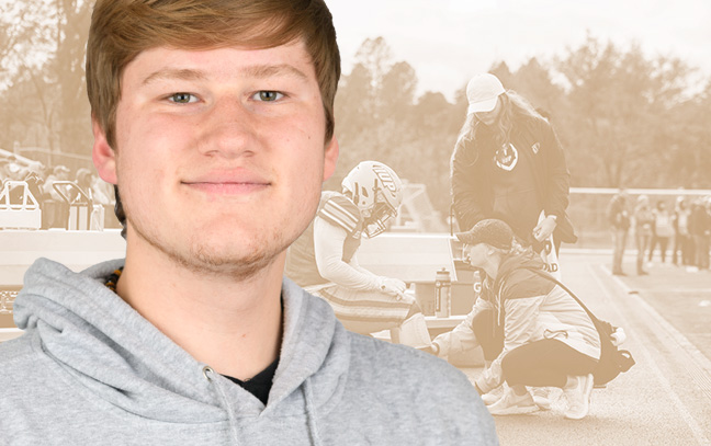 A student being superimposed in front of a cider-colored background with two people talking on the sidelines during a game.