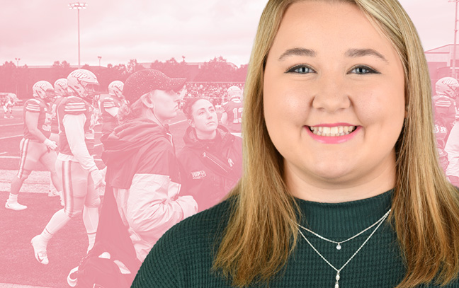 A student being superimposed in front of a hot-pink background showing a football player talking to trainers on the field during a game.