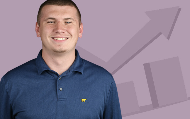 A student being superimposed in front of a sand-pink background with a stock chart.