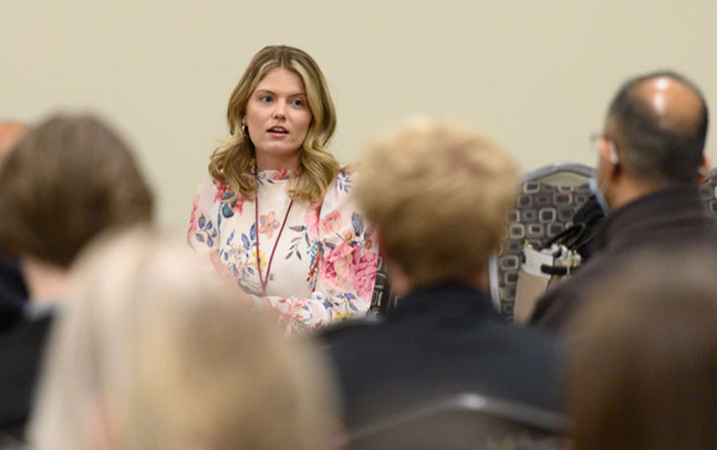 a speaker addresses a group in a classroom