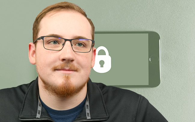 A student being superimposed in front of a green background showing a phone with a lock on its screen.
