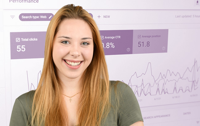 A student being superimposed in front of a magenta background showing graphs on a screen.