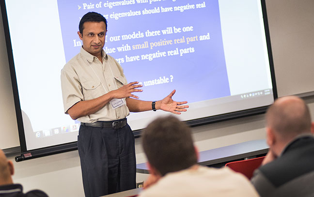 professor lecturing at the front of class