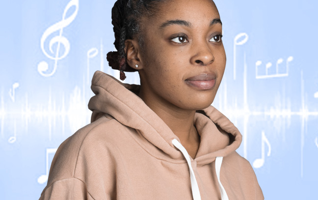 A student being superimposed in front of a blue background showing musical notes.