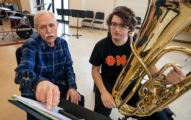 Jim Self instructing a student in a music lesson