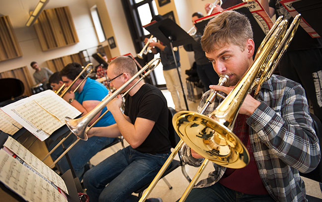 Trombone players playing together