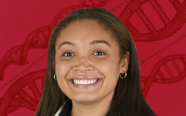 A female in front of a red backdrop with DNA strands