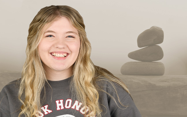 Female picture with light yellow stone background image 