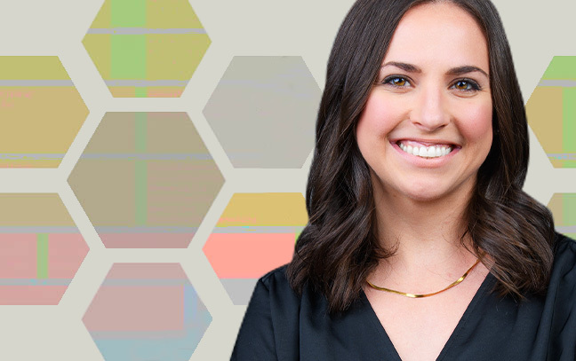 headshot of a student standing in front of an array of multicolored hexagons