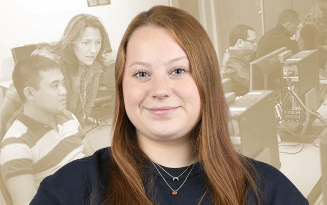 A student being superimposed in front of a muted-yellow background showing students working in a computer lab.