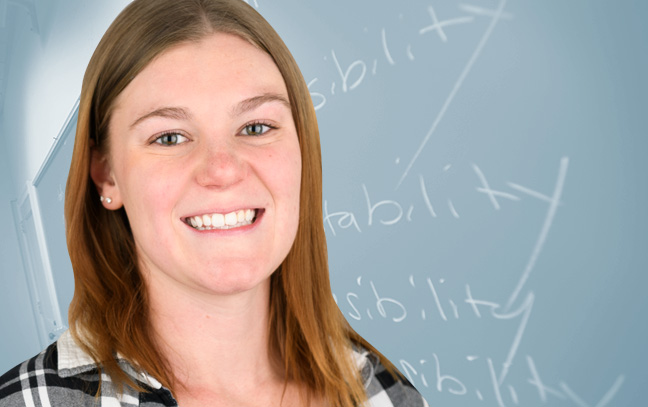 A student being superimposed in front of a blue background showing a chalkboard in a classroom.