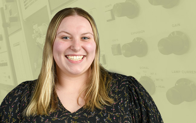 A student being superimposed in front of a yellow background showing a panel of buttons and knobs.