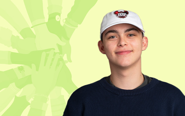 A student wearing an IUP ball cap and a black shirt in front of a yellow-green background with a graphic of outstretched stacked hands 