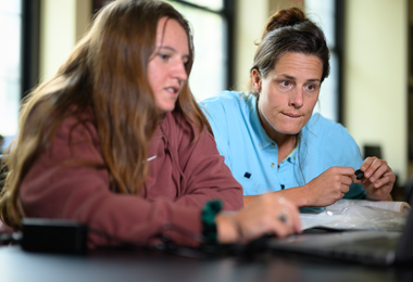 A navigator having a discussion with a student