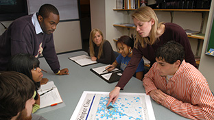 A criminology professor points out details on a crime map