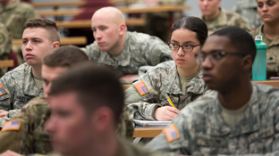 a class of ROTC students in fatigues take part in a class