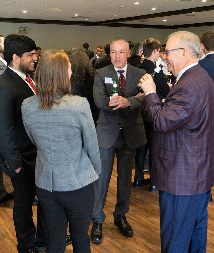 The 2022 SAA Recognition Dinner began with a mingling session. Shown here are two accounting students, Erin McGrath and Dominic Rocco, networking with IUP alumni Dan Simoni ’94, managing partner, PwC-Tulsa, and William Shipley ’75, retired partner, PwC-Pittsburgh.