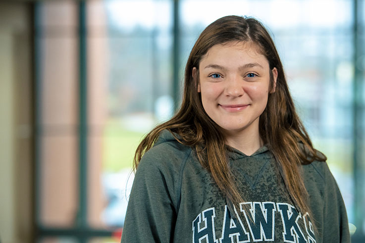 Abby smiles in the lobby of the KCAC.