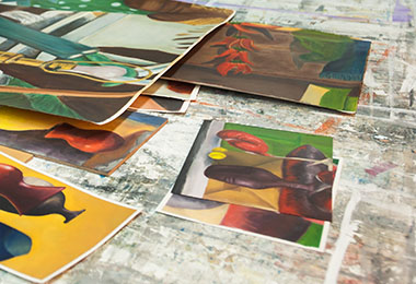 Paintings laid out on a table